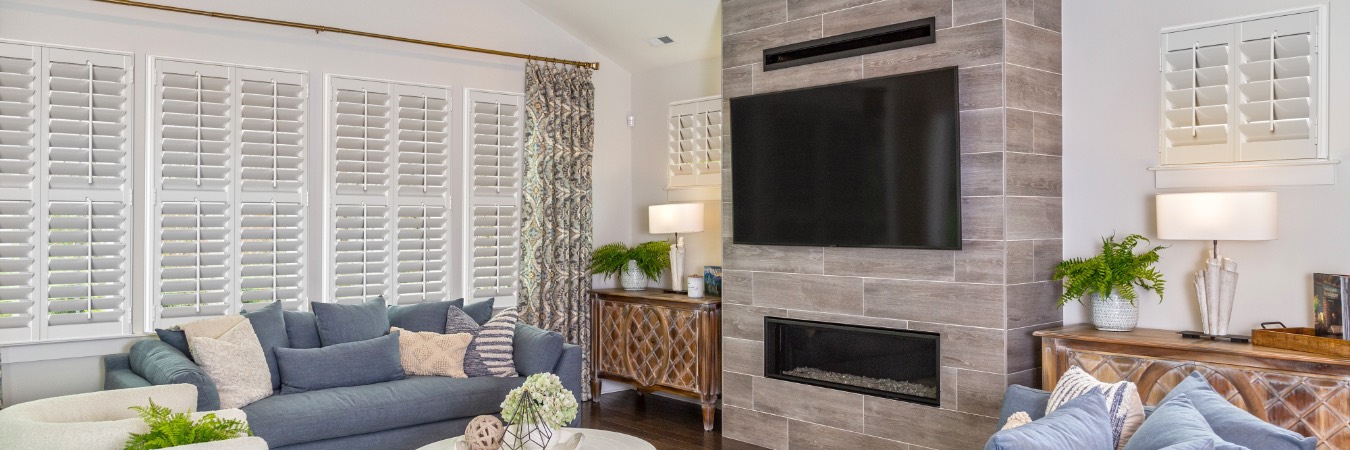 Plantation shutters in Hunt Valley living room with fireplace